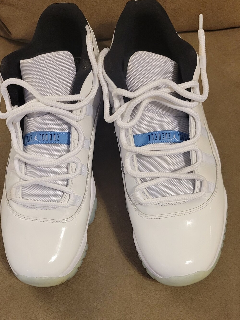 Men's Classic Jordan 11s White Low-Top Sneakers with Carolina Blue Accent
